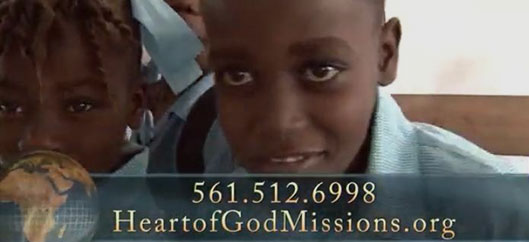 A young boy is smiling for the camera.